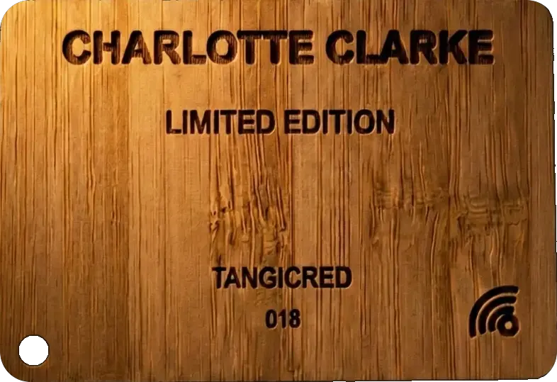 The NF-CD: a laser-engraved bamboo card reading Charlotte Clarke, Limited Edition, TangiCred, number 018, with the tap-waves mark